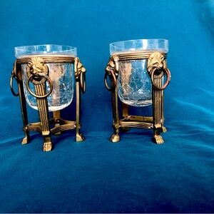 Brass lions head candle holders with crackle glass.